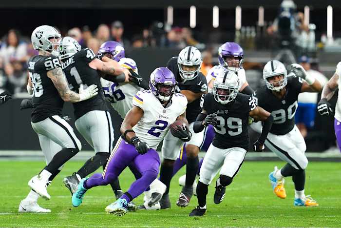 Dec 10, 2023; Paradise, Nevada, USA; Minnesota Vikings running back Alexander Mattison (2) gains yardage against the Las Vegas Raiders during the second quarter at Allegiant Stadium.